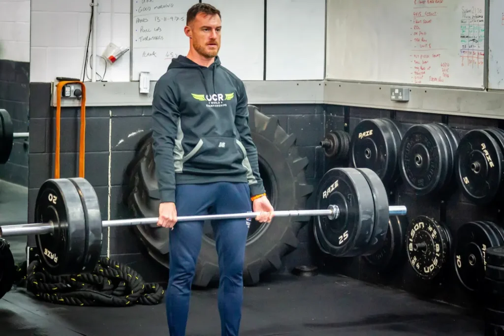 Barbell deadlift lockout with full hip extension and upright torso